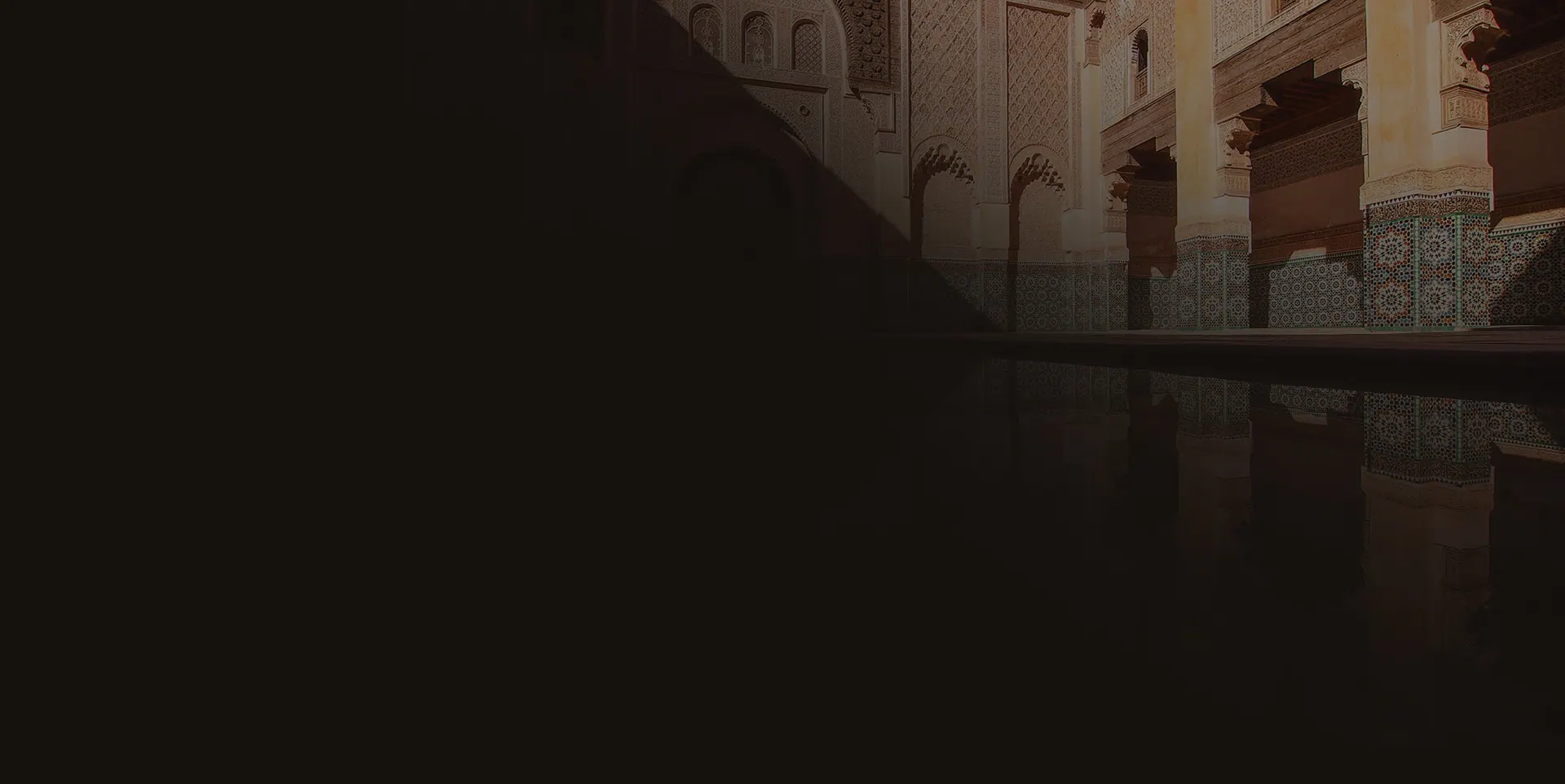 Arched mosque interior with geometric tilework